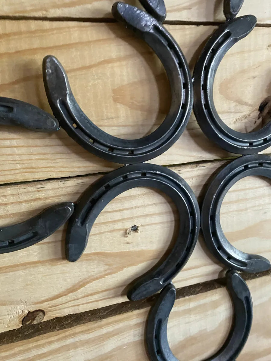 Cross made from horse shoes