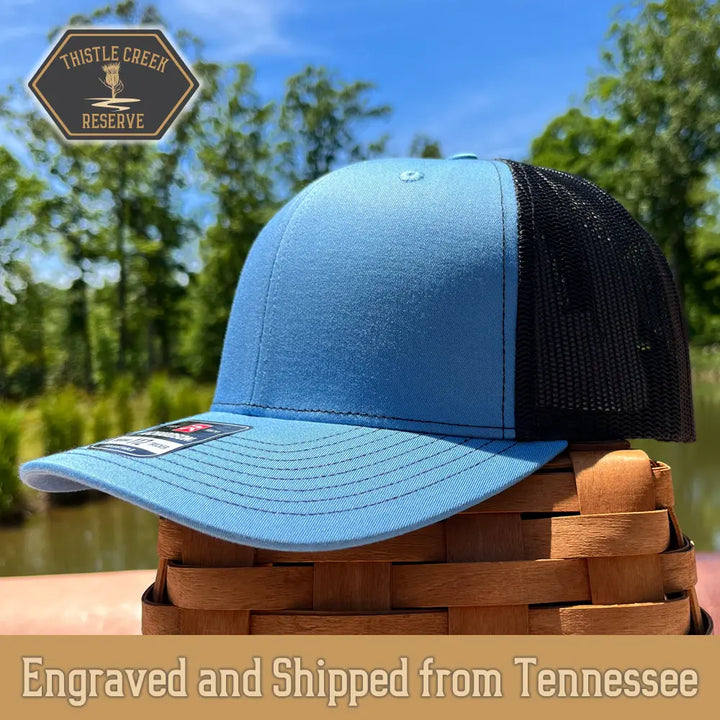 light blue and black hat