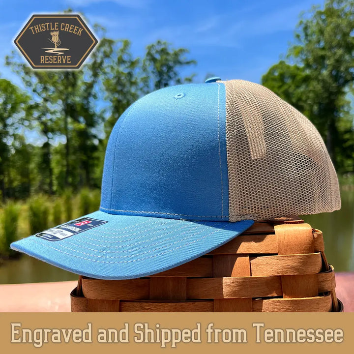 light blue and khaki hat