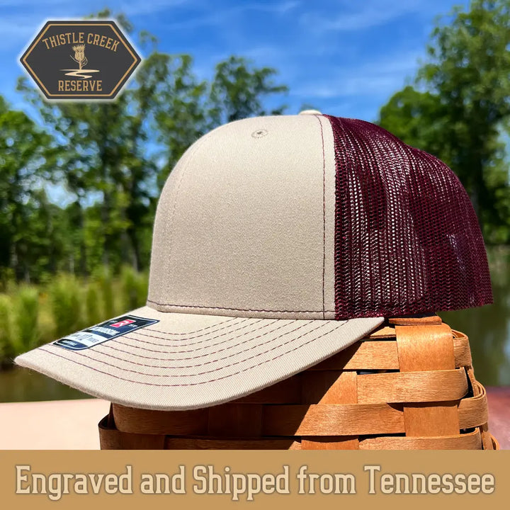 tan and burgundy hat