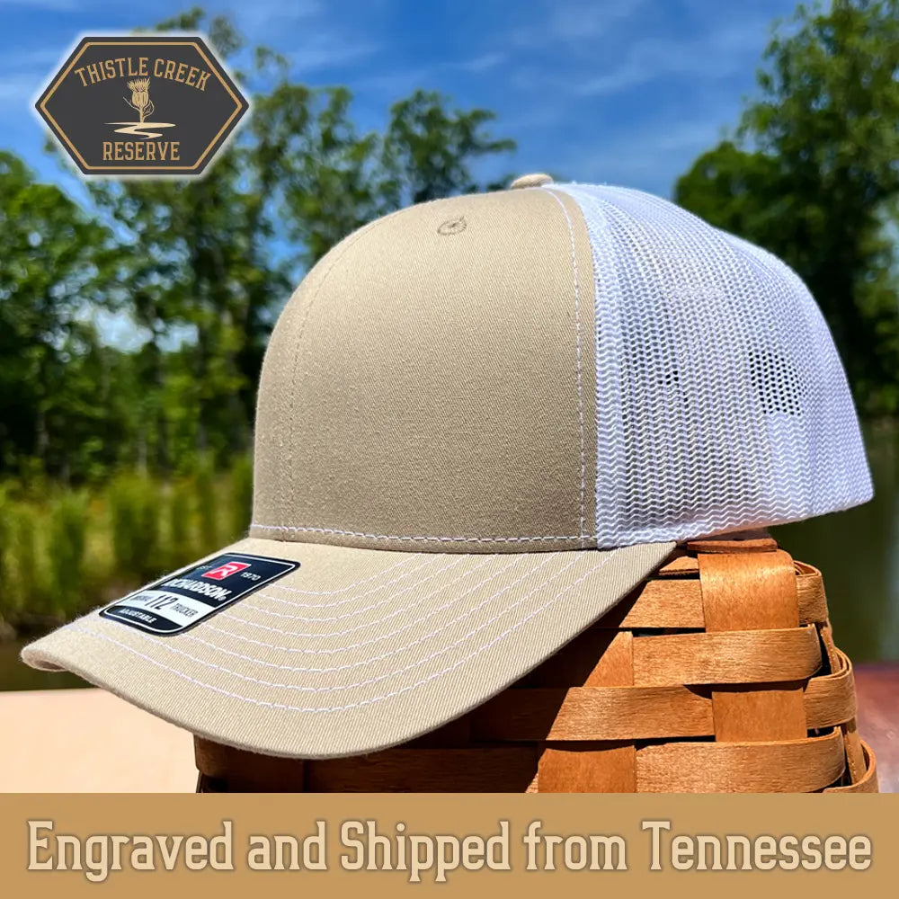tan and white hat