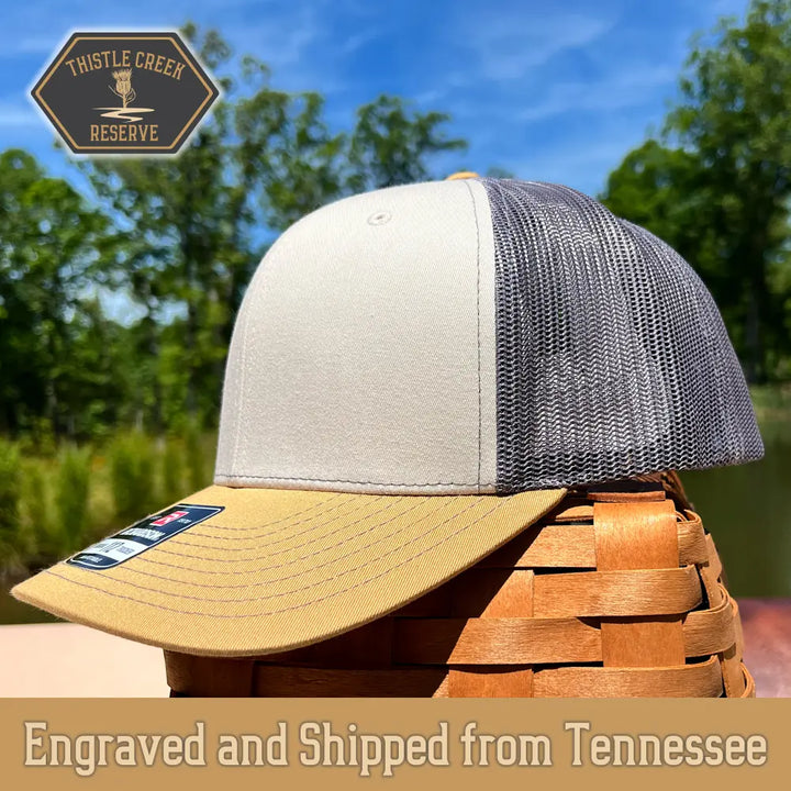 tan white and grey hat