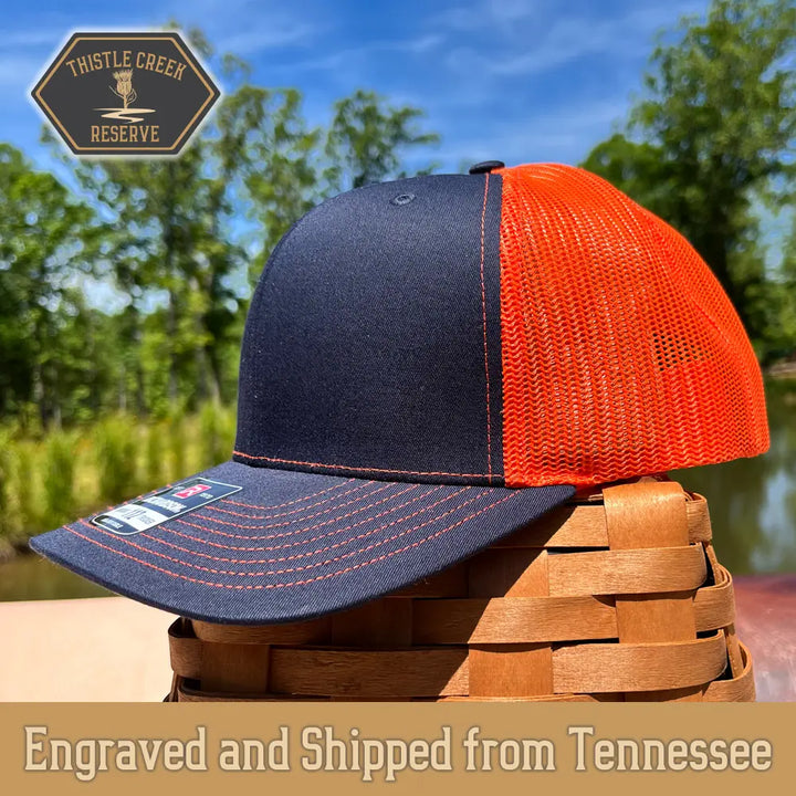 navy blue and orange hat