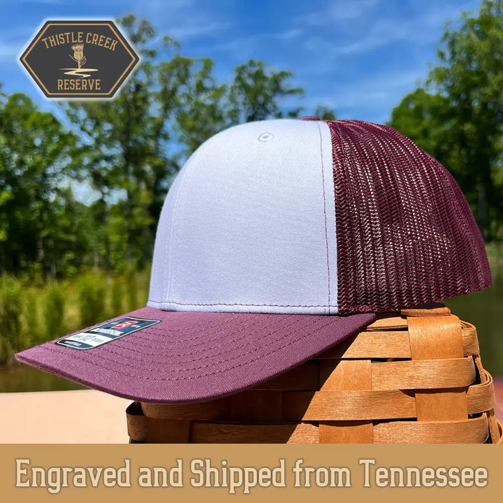 burgundy and white hat