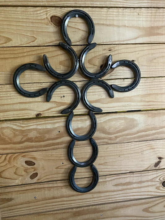 Cross made from horse shoes